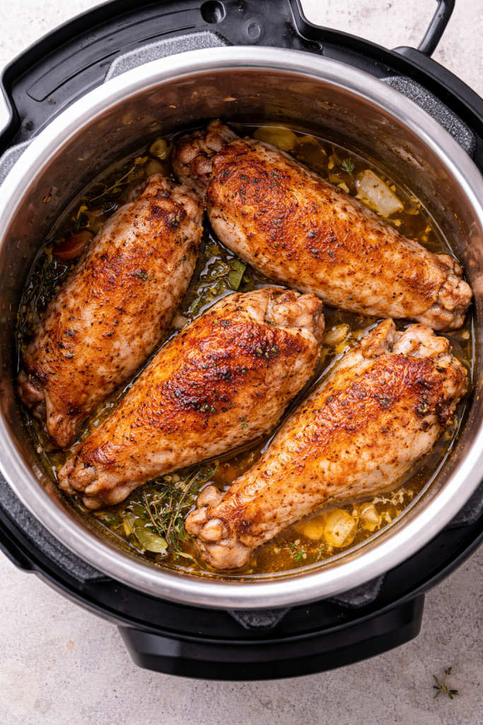 overhead shot of the pressure cooker set with turkey wings inside